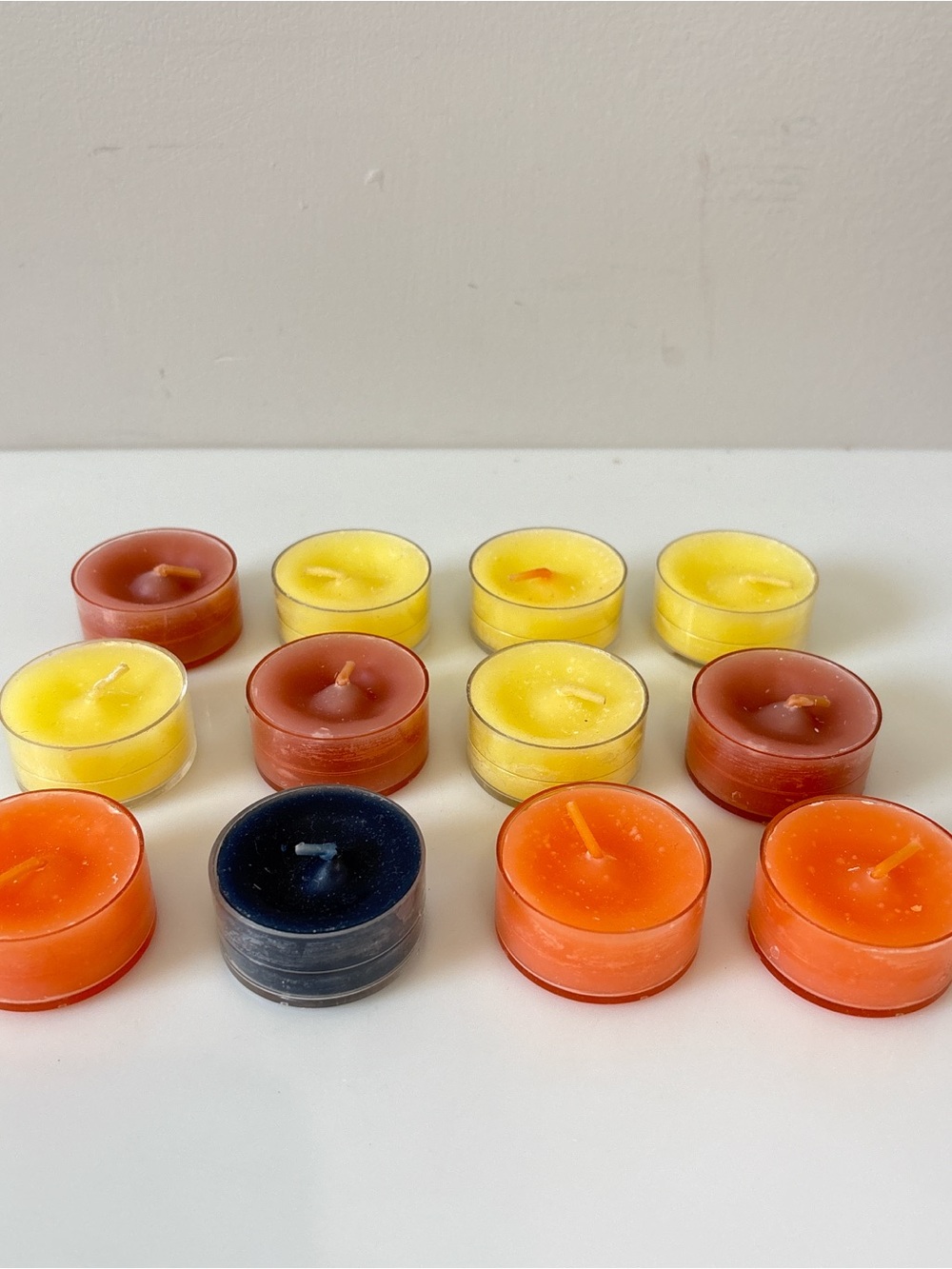 Lot of 12 Assorted Partylite Tealight Candles. Unknown scents. Unburned.